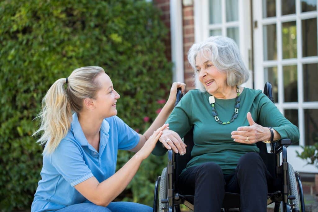 Senior Lady in the wheelchair with the young lady